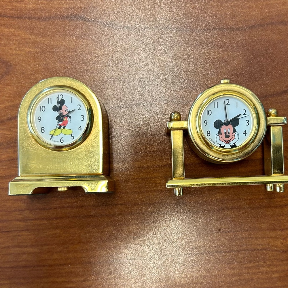 Mickey Mouse Quartz Desk Clocks 2.25” high. New batteries. Brass Goldtone (2).
